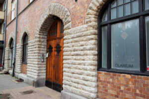 a facade of natural stone around windows and doors