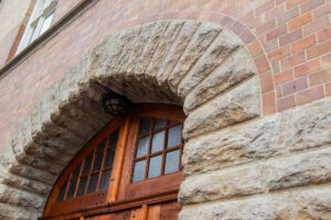 a facade of natural stone around windows and doors
