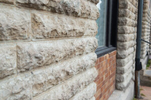 stone veneer installation on fasad
